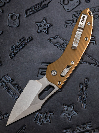 Microtech 169RL-11GTTA Stitch RAM-LOK Manual Folding Knife 3.625" Bohler M390MK Stonewashed Spear Point Combo Blade, Tan G10 Handles, AXIS/Crossbar Lock